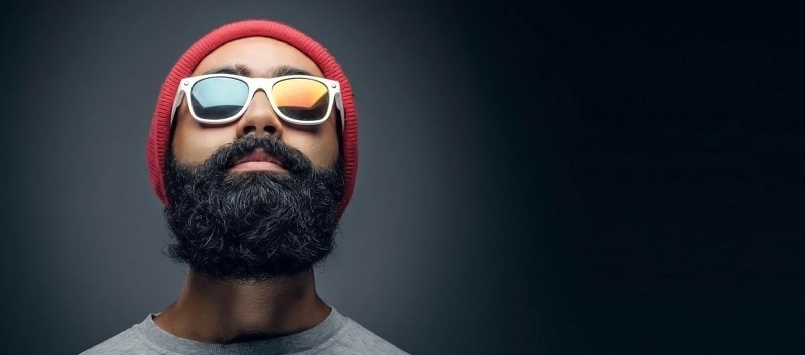 A man with a full beard and thick hair